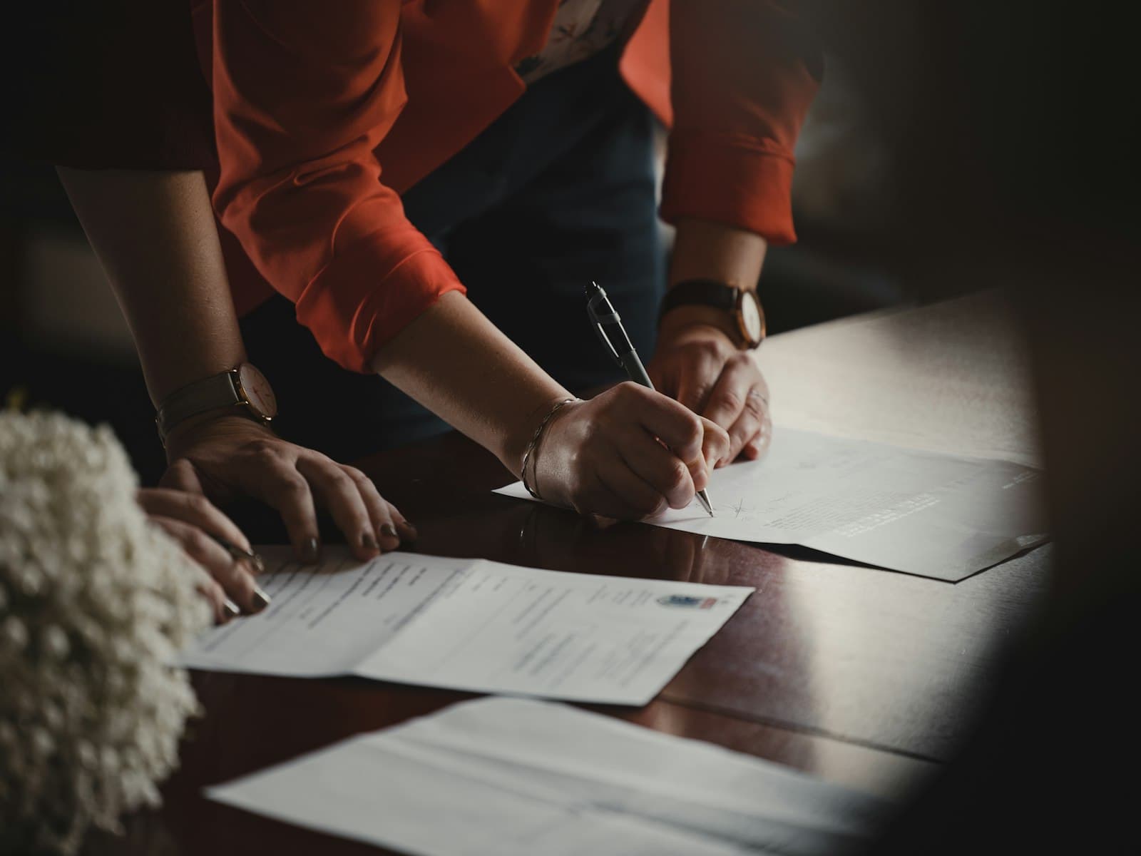 Checking business paperwork and documents at a desk